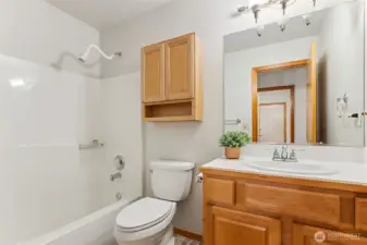 Guest bath offers a tub/shower combo.