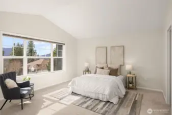 Primary suite upstairs has a scenic view of the mountains