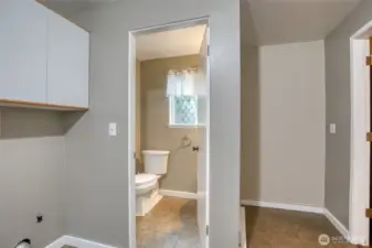 laundry area and half bath