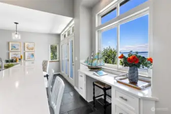 This work station in the kitchen offers perfect lighting for zoom calls, and an incredible view between them!