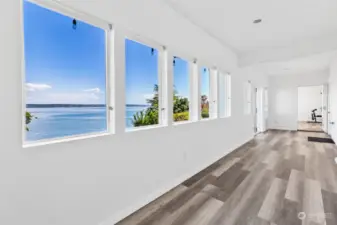 This sunroom area is the perfect spot for a wellness retreat. Add your cold plunge and sauna to round out a spa like experience at home!