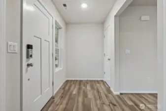 Entry w/Foyer space-Disclaimer- Photos are of another Warren-2448 floor plan from a previous community, photos are for illustrative purposes only. Finishes, flooring, upgrades, or other features may vary.