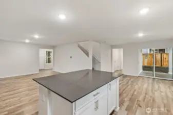 Open Concept Living/Dining Kitchen-Disclaimer- Photos are of another Warren-2448 floor plan from a previous community, photos are for illustrative purposes only. Finishes, flooring, upgrades, or other features may vary.