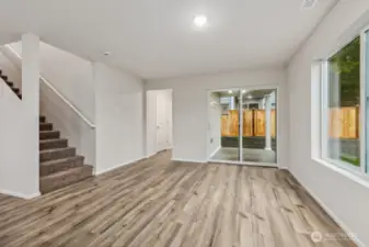 Open Concept Living/Dining Kitchen-Disclaimer- Photos are of another Warren-2448 floor plan from a previous community, photos are for illustrative purposes only. Finishes, flooring, upgrades, or other features may vary.