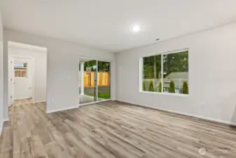 Open Concept Living/Dining Kitchen-Disclaimer- Photos are of another Warren-2448 floor plan from a previous community, photos are for illustrative purposes only. Finishes, flooring, upgrades, or other features may vary.