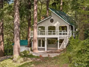 This thoughtfully designed custom home offers a large outdoor deck and a durable metal roof.