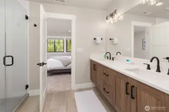 Dual vanities and large walk-in closet.