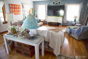 Living Room with Access tot he Backyard and a Wood Burning Fireplace