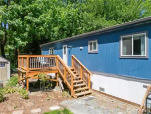 Deck access leads to garden in back.