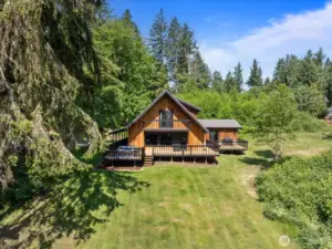 Aerial view of home and some of the acreage.