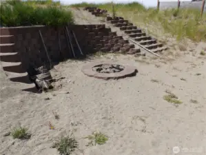 Creative steps leading west up the dune to the beach.