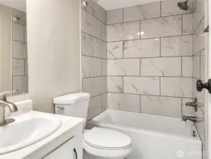 Updated main bathroom with fresh finishes and full tub/shower