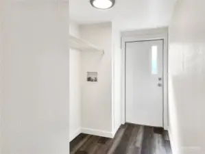 Laundry area with access to the back porch — function meets flow.