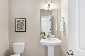 Main floor powder room off kitchen and family room