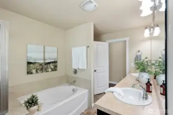 Primary bath with dual sinks, tub, and separate shower