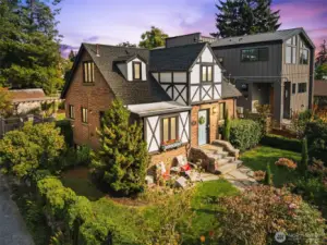 Stunning brick exterior, timber frame and gable new roof creates an elegant and classic Tudor look.