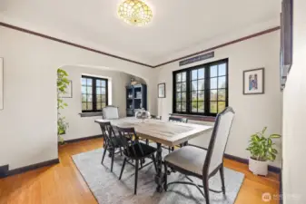 Elaborate archways reveals stunning craftsmanship in this dining room with enclave.