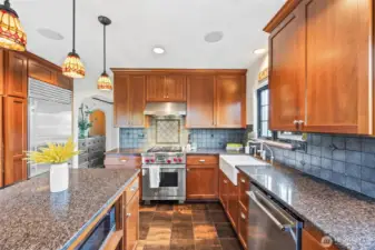 The warm finishes in this luxurious kitchen with fireclay apron sink is the perfect place to host holiday gatherings.