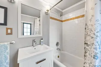 Full updated bath with Pottery Barn fixtures and classic subway tile.