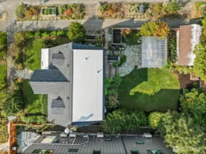 Well-maintained Tudor surrounded by lush landscape, garden beds and entertainment areas or for relaxation.
