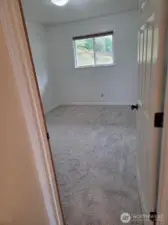 One bedroom with new carpet.