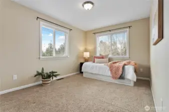One of two upstairs bedrooms with an added window for natural light