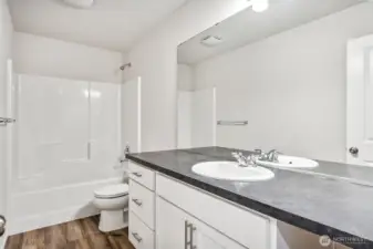 Full Guest Bath-Disclaimer- Photos are from a similar floor plan from another community, photos are for illustrative purposes only. Finishes, flooring, features, upgrades, countertops, paint, colors, and other features may vary.