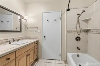 The primary bedroom enjoys convenient access to the main bath while still serving the rest of the home