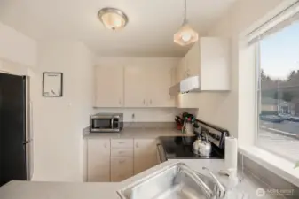 A view from the dining room into the kitchen.