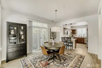 The dining room flows into the large kitchen with all new LVP flooring and abundant light.
