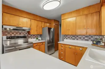 Look at the oversized stove, double oven, top of the line.