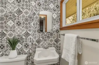 Guest half bath is cute and great natural lighting in here too!