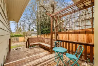 Deck with sitting area off the side door. Excellent place to have your morning coffee. Check out that new fence behind it. Private and Peacefull