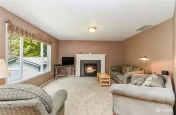 Family room with propane fireplace and good space.