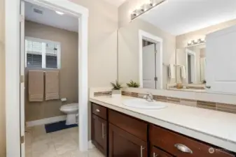 Upper level full bathroom with back-to-back counters/sinks