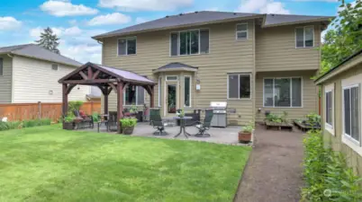 Backyard features a large patio for all of your outdoor entertaining.