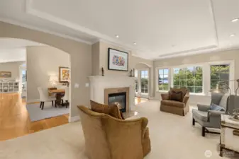 Living room with fireplace and view of Lake Washington and Mt. Rainier