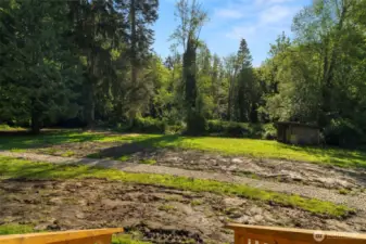 Updated drainage system and sunny exposure in the backyard make it a great spot for a garden. Shed was previously used as a chicken coop.