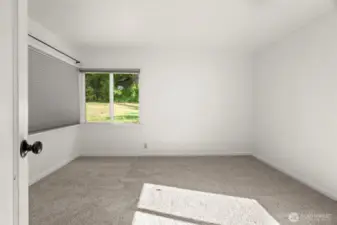 Primary bedroom with brand new carpet.