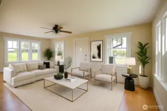 Living room with original hardwood floors, virtually staged.