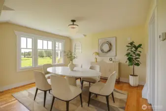 Nice size dining room with lots of light, virtually staged.