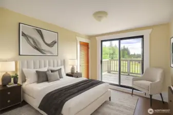 Upstairs bedroom with a walkout deck is virtually staged.