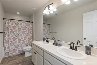 Upper level bathroom to the left of the stairway