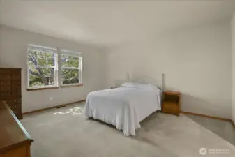 The primary suite is generous in size. It will comfortably accommodate a king size bed with nightstands and dressers.