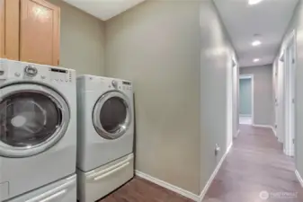 Down the hall from the bedrooms and just before the garage, you will find your included washer and dryer.