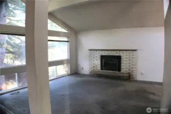 Big living room, vaulted ceiling and huge windows