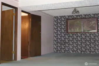 Bonus room entry on right and Laundry/bath door on left