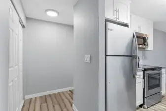 This view shows the entry hallway and coat closet off of the kitchen.