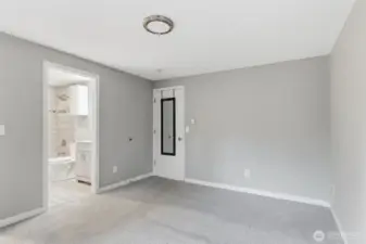 Another view of the primary bedroom and bathroom location.