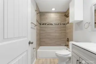 Another view of the stylish tile work in the primary bathroom.